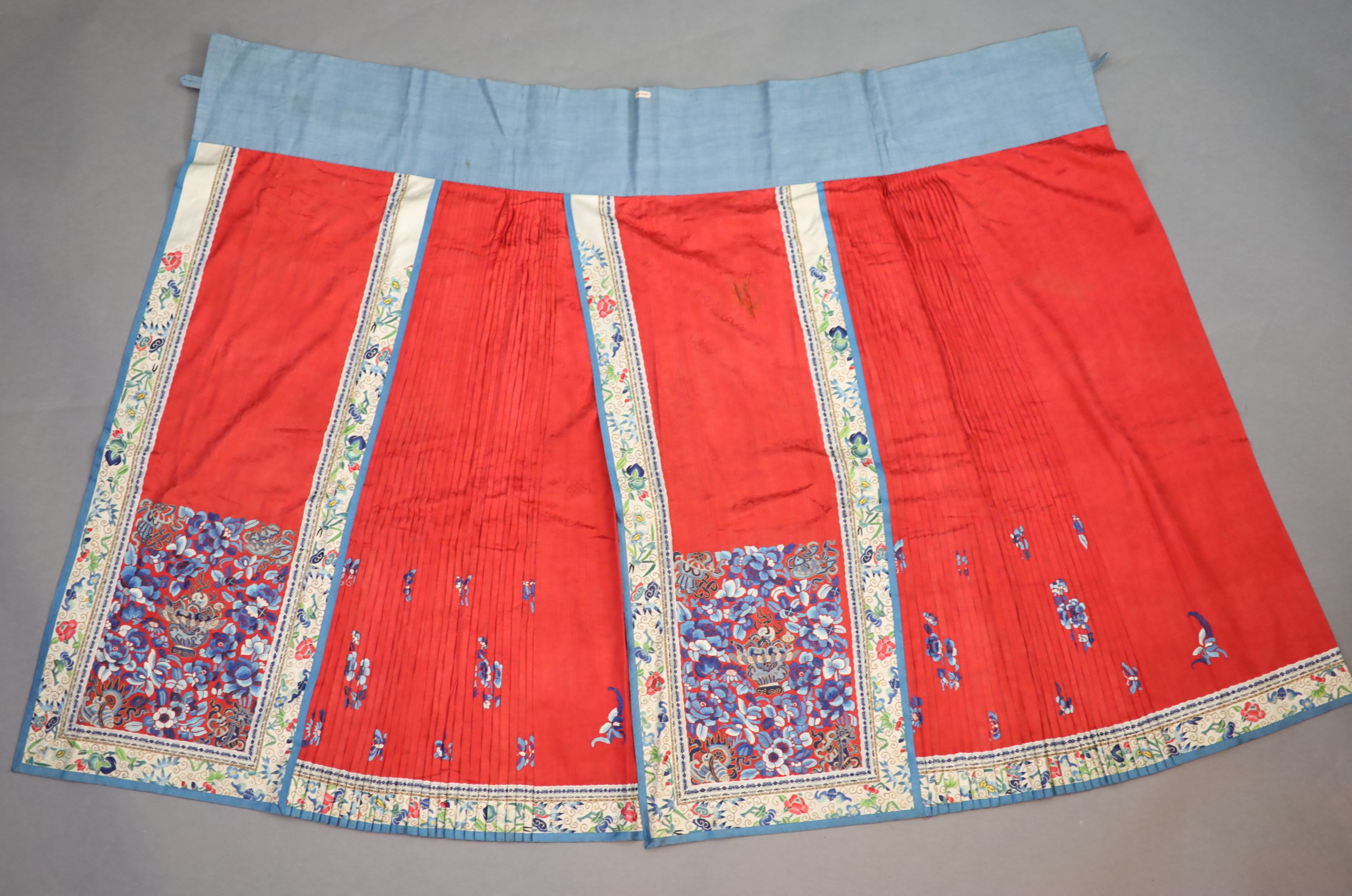 A 19th century Chinese red ground silk skirt